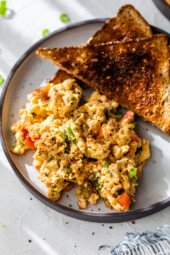 Huevos pericos on plate with 2 slices of toast