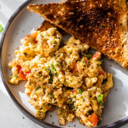 Huevos pericos on plate with 2 slices of toast