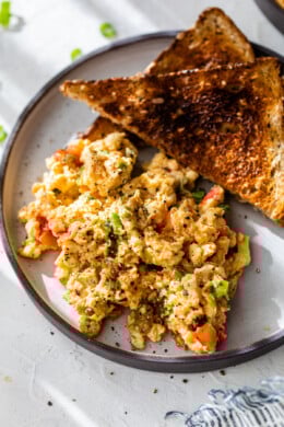 Huevos pericos on plate with 2 slices of toast
