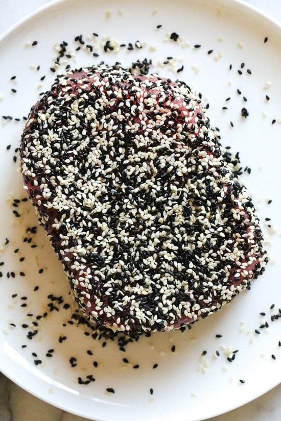 Sesame Crusted Tuna Steak on Arugula drizzled with a balsamic soy-ginger vinaigrette – yum!