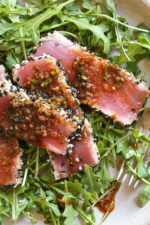 Sesame Crusted Tuna Steak on Arugula drizzled with a balsamic soy-ginger vinaigrette – yum!