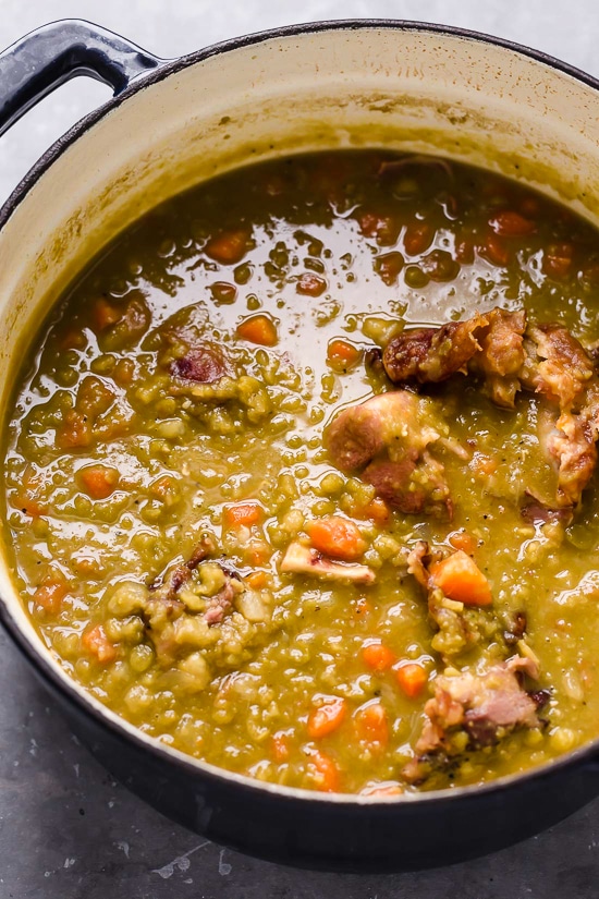 This easy split pea soup with ham is what I crave on cold nights! It's a comforting recipe made with just 6 ingredients not counting salt. A dutch oven with split pea soup and ham.
