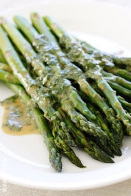 A simple asparagus side dish that really celebrates Spring. Serve it cold or room temperature, leftovers are wonderful chopped and mixed into a salad.