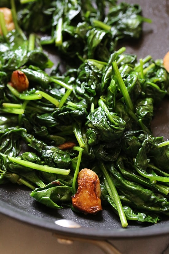 Wilted Baby Spinach with Garlic and Oil is my favorite way to prepare this easy side dish made with just 3 ingredients and ready in under 10 minutes.