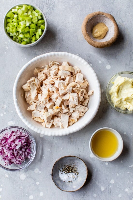 Mixing classic chicken salad ingredients