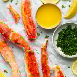 King Crab Legs with butter and lemon wedges