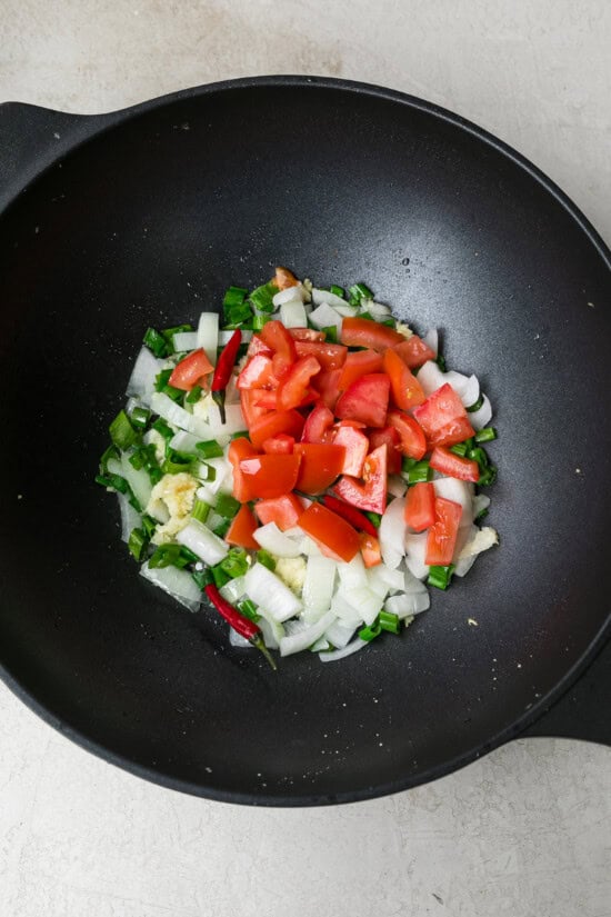 add veggies to wok