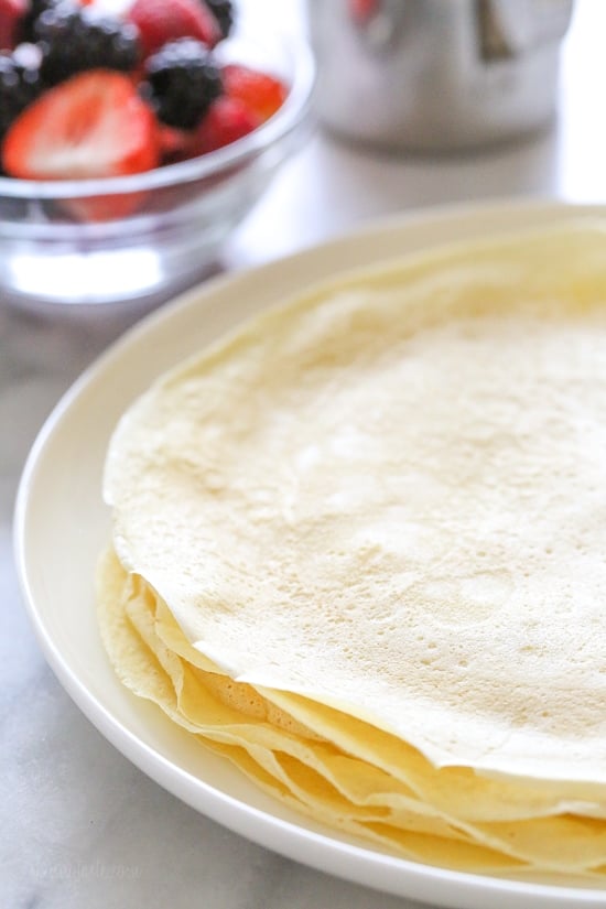 With just 4 main ingredients and everything prepared in the blend, this Easy Crepes Recipe is virtually foolproof! These blender crepes are so easy to make, and are perfect to serve for breakfast or dessert. They can be filled with fruit, jam, yogurt, ice cream, you name it!