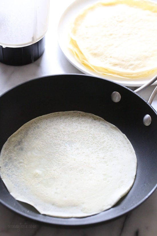 With just 4 main ingredients and everything prepared in the blend, this Easy Crepes Recipe is virtually foolproof! These blender crepes are so easy to make, and are perfect to serve for breakfast or dessert. They can be filled with fruit, jam, yogurt, ice cream, you name it!