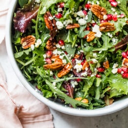 This beautiful, delicious fall or winter salad is made with mixed baby greens, pomegranate, gorgonzola and pecans with a pomegranate vinaigrette.
