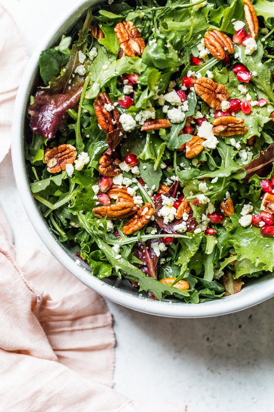 This beautiful, delicious fall or winter salad is made with mixed baby greens, pomegranate, gorgonzola and pecans with a pomegranate vinaigrette.