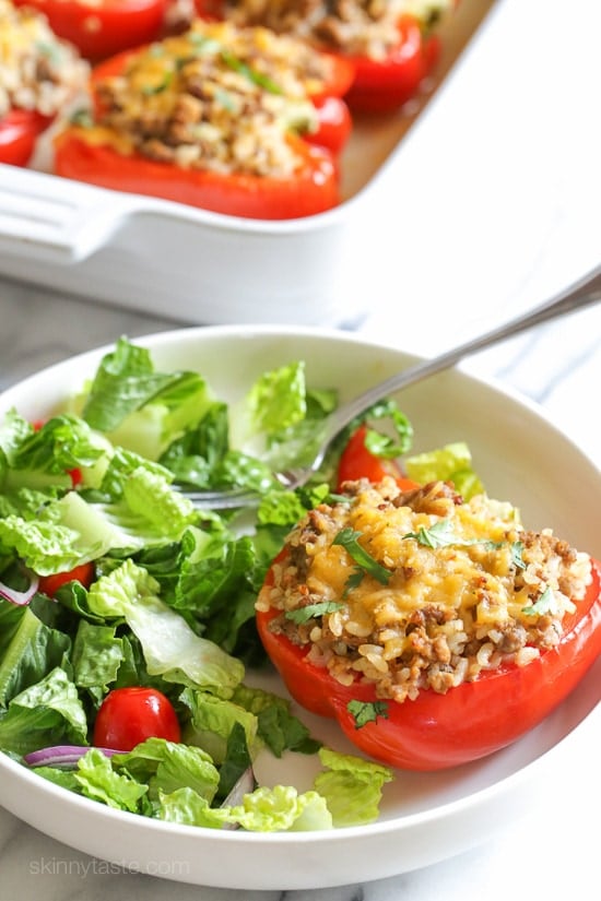 Delicious peppers stuffed with ground turkey and brown rice, seasoned with cumin, cilantro and spices then baked and topped with cheese are one of my favorites!