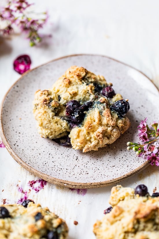 A blueberry scone on a plate.