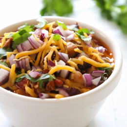 This easy turkey chili recipe uses lean ground turkey and a whole lotta beans! Make this in the slow cooker or Instant Pot, then pile on your favorite chili toppings and enjoy!