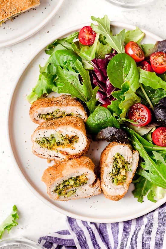 Broccoli and Cheese Stuffed Chicken is filled with cheddar and broccoli, then rolled up, breaded and baked in the oven or air fryer!