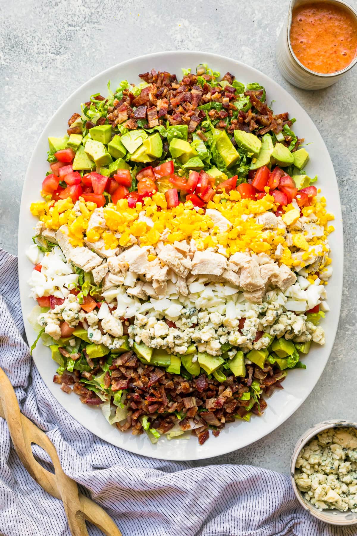 Overhead view of Cobb salad with red wine tomato vinaigrette
