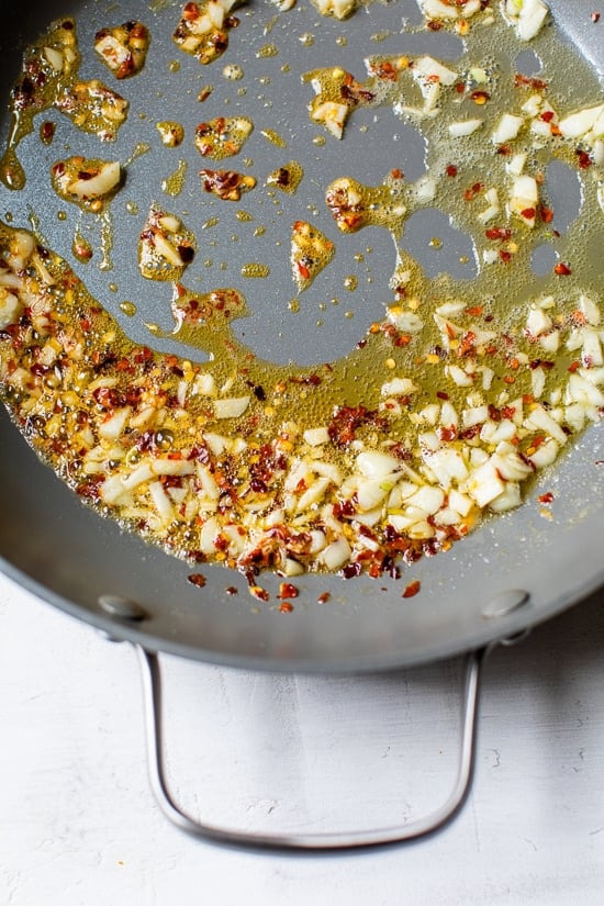 oil and red chili flakes in a skillet