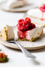 No-bake cheesecake slice on plate with tip of cake on fork