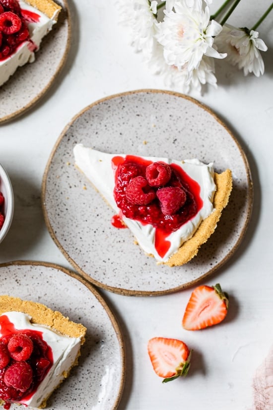 Overhead view of no-bake cheesecake on plate topped with berries
