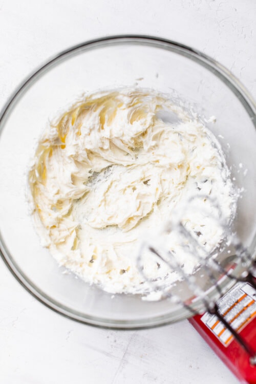 Beating no-bake cheesecake filling in mixing bowl
