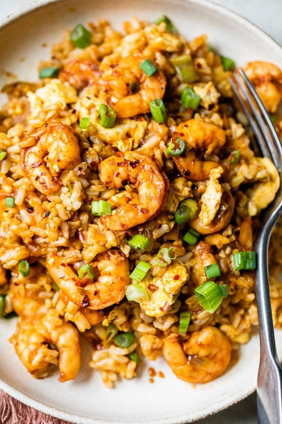 Spicy Shrimp Fried Rice made healthier using leftover cooked brown rice, a delicious whole grain that's high in fiber, so it fills you up.