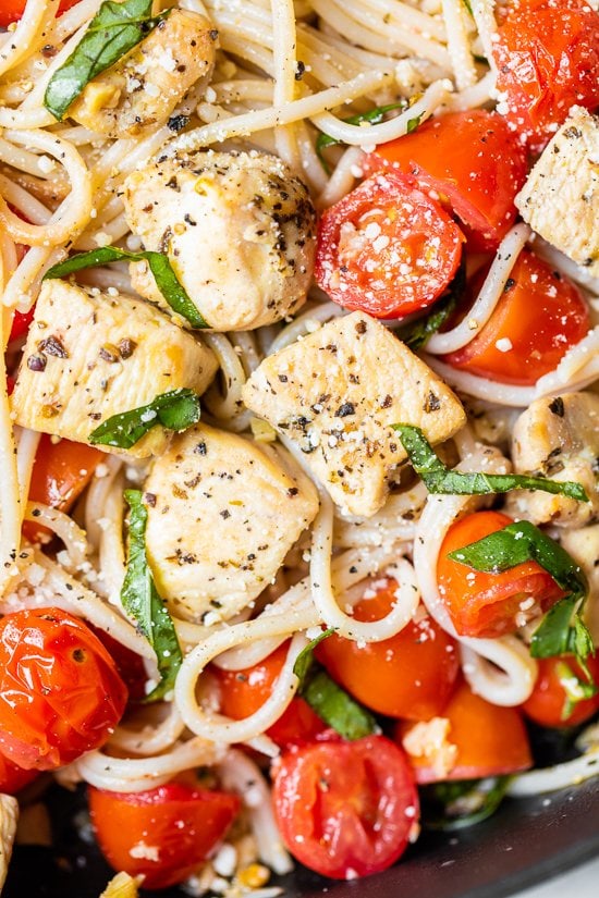 Spaghetti with Sauteed Chicken and Grape Tomatoes on a plate.