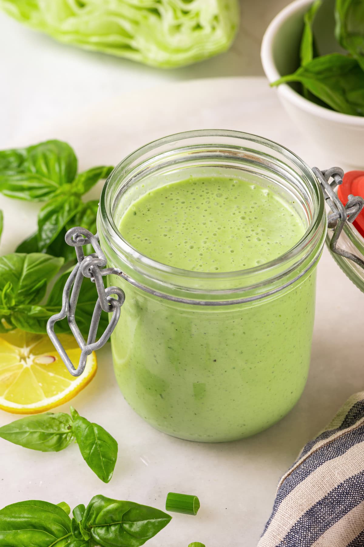 Basil green goddess dressing is the perfect way to give your next salad an upgrade! This version is lightened up, but still rich and creamy. Jar of basil green goddess dressing
