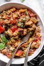 This simple Eggplant and Tomato Sauce is delicious, made with diced eggplant stewed in tomatoes and garlic. I love it served over pasta but it's also great as a side dish on it's own.