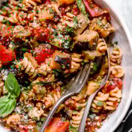 This simple Eggplant and Tomato Sauce is delicious, made with diced eggplant stewed in tomatoes and garlic. I love it served over pasta but it's also great as a side dish on it's own.