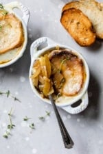 Spoon in bowl of French onion soup