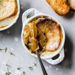 Spoon in bowl of French onion soup