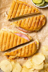 2 turkey Cuban sandwiches sliced in half