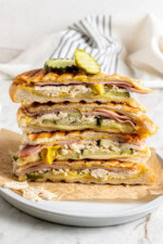 Stack of leftover turkey Cuban sandwiches on plate