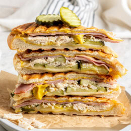 Stack of leftover turkey Cuban sandwiches on plate