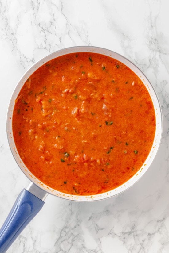 Penne alla Vodka is a simple yet showstopping pasta dish. The creamy tomato vodka sauce comes together in less than 30 minutes. Tomato vodka sauce in a saucepan