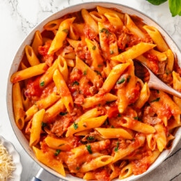 Overhead view of a dish of penne with vodka sauce