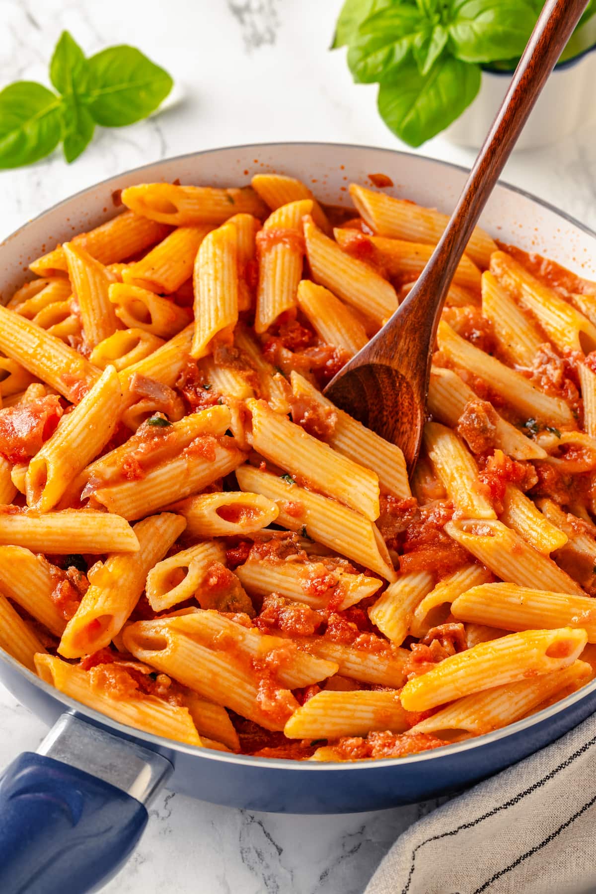 Penne alla Vodka is a simple yet showstopping pasta dish. The creamy tomato vodka sauce comes together in less than 30 minutes. A fork in a bowl of penne alla vodka