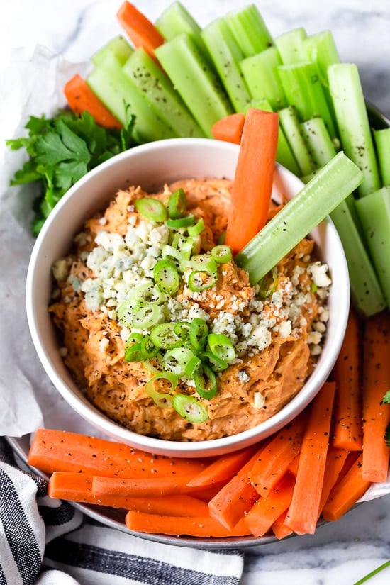 This Slow Cooker Buffalo Chicken Dip has everything you love about buffalo wings, only made into a dip – no messy hands!