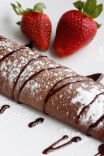 Satisfy your chocolate craving with these delicious, easy to make crepes filled with strawberries and cream. The perfect Valentine's Day breakfast or dessert! You can make the batter ahead of time and refrigerate what you don't use.