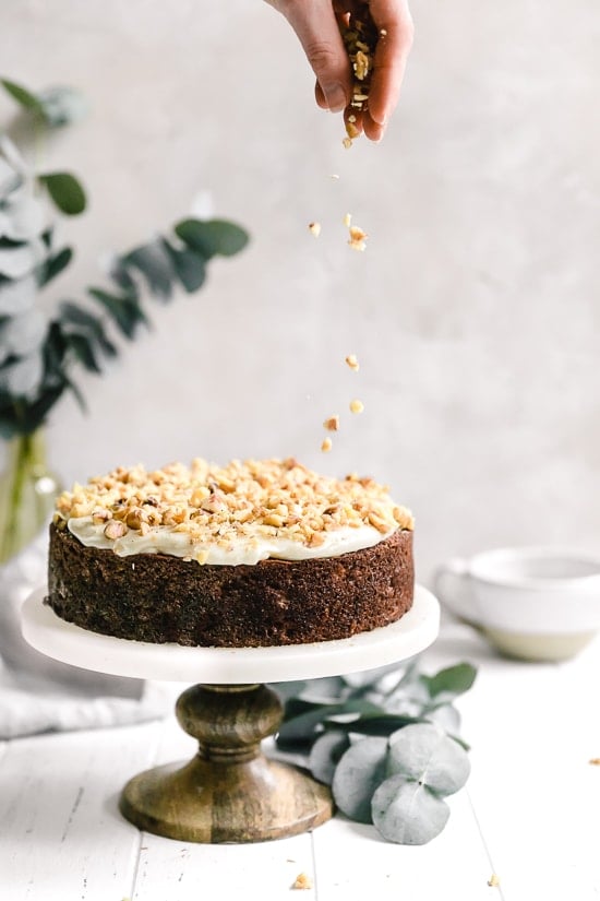 This super moist carrot cake recipe made from scratch is perfect for Easter or anytime of the year. Made with a can of crushed pineapple which makes it very moist, without adding a ton of fat.