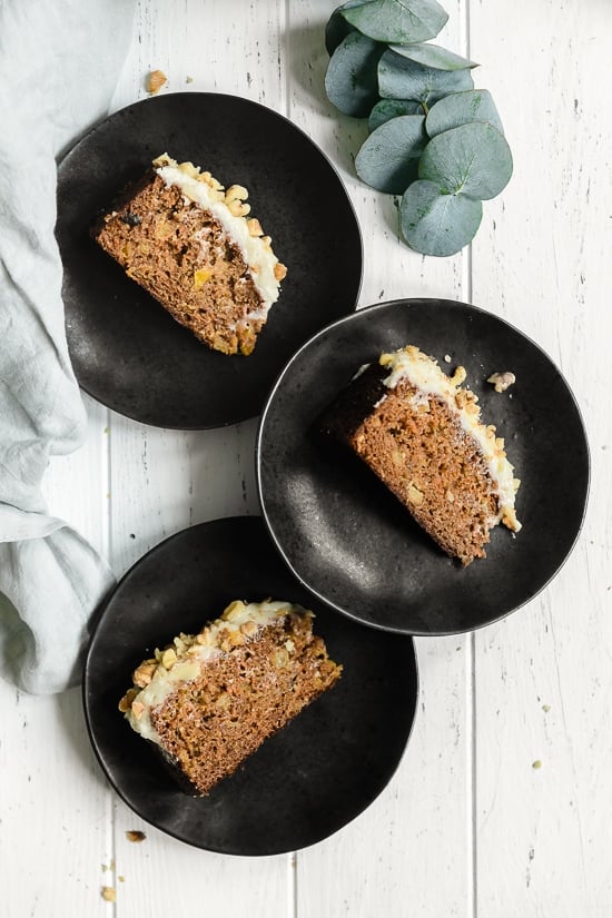 This super moist carrot cake recipe made from scratch is perfect for Easter or anytime of the year. Made with a can of crushed pineapple which makes it very moist, without adding a ton of fat.