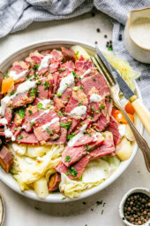Corned Beef and Cabbage on a plate with a fork and knife