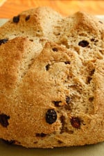 I love to have Irish Soda Bread for breakfast hot out of the oven with some low fat spread and a cup of tea. This is very easy to make, even if you have no experience baking. If you prefer to make a bread to serve with dinner, omit the raisins and sugar and you can add caraway seeds.