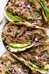 Slow Cooker Pork Carnitas or Mexican Pulled Pork is the best Mexican pork recipe whether you stuff it into a tortilla, taco or turn it into a burrito bowl!