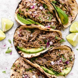 Slow Cooker Pork Carnitas or Mexican Pulled Pork is the best Mexican pork recipe whether you stuff it into a tortilla, taco or turn it into a burrito bowl!