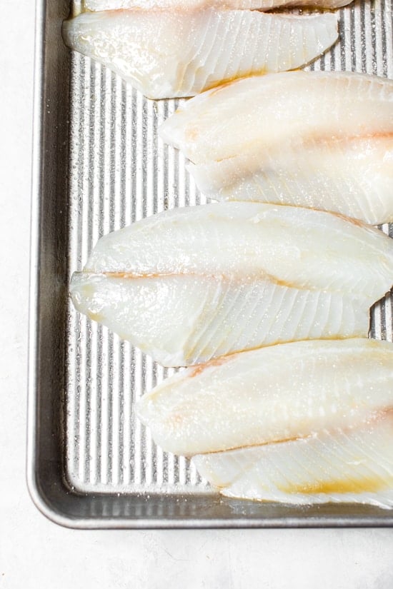 Broiled Tilapia with Thai Coconut Curry Sauce has so much flavor, perfect over jasmine rice to absorb all the delicious sauce.