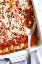 The secret to the best, irresistible manicotti is to make them from scratch with my easy homemade crespelles, which are basically Italian crepes. These spinach and cheese manicotti are filled with three cheeses – ricotta, mozzarella and parmesan, then topped with homemade sauce. So damn delicious!