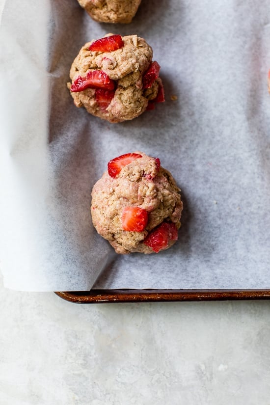 These simple strawberry scones made lighter are a wonderful breakfast and a delicious way to use up fresh summer strawberries! Scoops of strawberry scone dough ready to bake.
