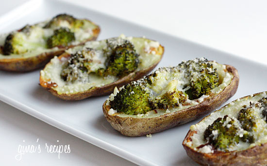 A plate of potato skins filled with broccoli and melted cheese