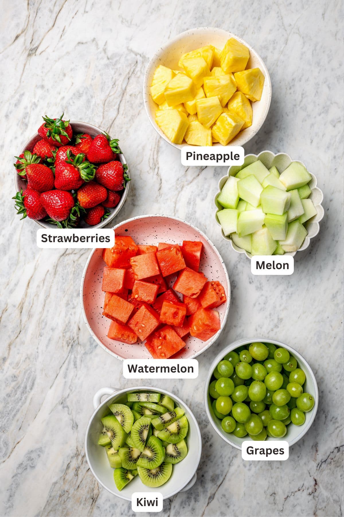 Overhead view of ingredients for fruit kabobs